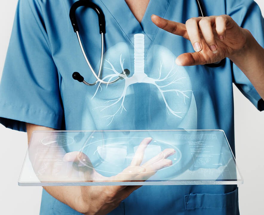 Pulmonologist examining a patient's lung X-ray at Synergy Super Speciality Hospital in Bhopal.